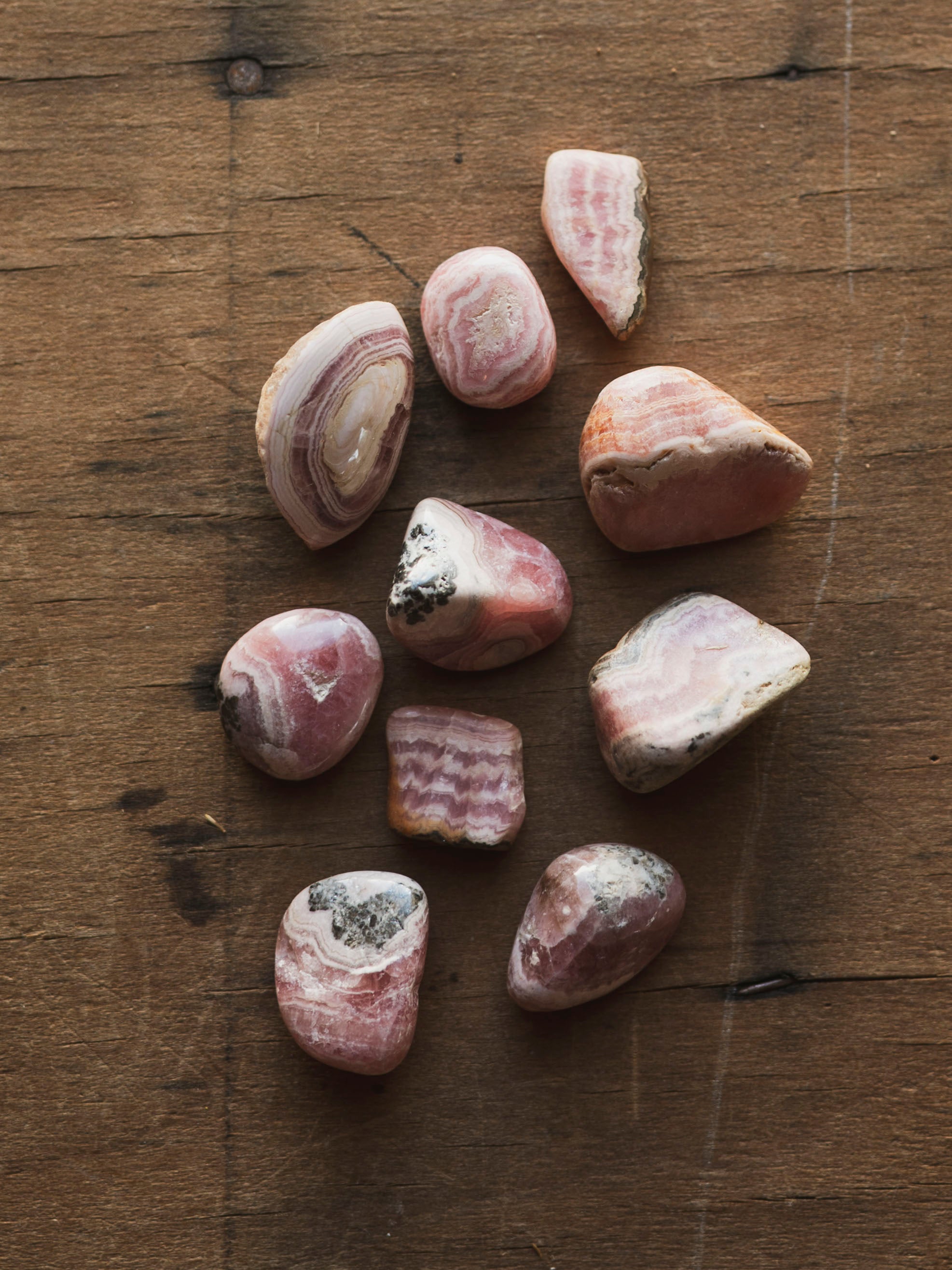 Pelt Rocks Polished Grade A Rhodochrosite, RM800 – Black Moth